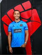 1 July 2025; Bohemians new signing Douglas James-Taylor poses for a portrait in the newly launched Oasis themed Bohemians jersey during his announcement at Dalymount Park in Dublin. Photo by Ramsey Cardy/Sportsfile