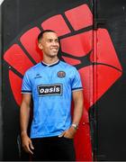 1 July 2025; Bohemians new signing Douglas James-Taylor poses for a portrait in the newly launched Oasis themed Bohemians jersey during his announcement at Dalymount Park in Dublin. Photo by Ramsey Cardy/Sportsfile
