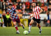 27 June 2025; Michael Duffy of Derry City in action against Luke Heeney of Drogheda United during the SSE Airtricity Men's Premier Division match between Derry City and Drogheda United at The Ryan McBride Brandywell Stadium in Derry. Photo by Shauna Clinton/Sportsfile