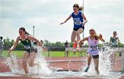 21 June 2025; Athletes, from left, Olivia Ryan of Ratoath College, representing Leinster, Emille McElvaney of Loreto Fermoy, representing Munster, and Annabelle McKenzie of Enniskillen Royal GS, representing Ulster, compete in the girls 1500m steeplechase during the 123.ie Irish Schools Athletics Association Tailteann Games at SETU Campus in Carlow. Photo by Sam Barnes/Sportsfile