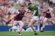 29 June 2025; Jordan Morris of Meath has a shot on goal despite the efforts of Jack Glynn of Galway during the GAA Football All-Ireland Senior Championship quarter-final match between Meath and Galway at Croke Park in Dublin. Photo by Shauna Clinton/Sportsfile