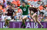 29 June 2025; Jack Glynn of Galway is tackled by Jordan Morris of Meath during the GAA Football All-Ireland Senior Championship quarter-final match between Meath and Galway at Croke Park in Dublin. Photo by Shauna Clinton/Sportsfile
