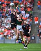 29 June 2025; Mark O'Shea of Kerry in action against Andrew Murnin of Armagh during the GAA Football All-Ireland Senior Championship quarter-final match between Armagh and Kerry at Croke Park in Dublin. Photo by Shauna Clinton/Sportsfile