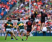 29 June 2025; Mark O'Shea of Kerry in action against Armagh players Paddy Burns, left, and Andrew Murnin during the GAA Football All-Ireland Senior Championship quarter-final match between Armagh and Kerry at Croke Park in Dublin. Photo by Shauna Clinton/Sportsfile