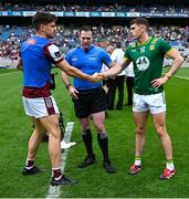 29 June 2025; Galway captain Sean Kelly, left, and Meath captain Eoghan Frayne, right, shake hands in front of referee Martin McNally before the GAA Football All-Ireland Senior Championship quarter-final match between Meath and Galway at Croke Park in Dublin. Photo by Shauna Clinton/Sportsfile