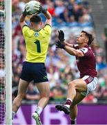 29 June 2025; Meath goalkeeper Billy Hogan makes a save despite the efforts of Seán Fitzgerald of Galway during the GAA Football All-Ireland Senior Championship quarter-final match between Meath and Galway at Croke Park in Dublin. Photo by Shauna Clinton/Sportsfile