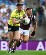 29 June 2025; Meath goalkeeper Billy Hogan makes a save despite the efforts of Seán Fitzgerald of Galway during the GAA Football All-Ireland Senior Championship quarter-final match between Meath and Galway at Croke Park in Dublin. Photo by Shauna Clinton/Sportsfile