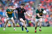 29 June 2025; Tom O'Sullivan of Kerry in action against Rory Grugan of Armagh during the GAA Football All-Ireland Senior Championship quarter-final match between Armagh and Kerry at Croke Park in Dublin. Photo by Shauna Clinton/Sportsfile