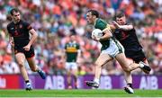 29 June 2025; David Clifford of Kerry in action against Oisin Conaty of Armagh during the GAA Football All-Ireland Senior Championship quarter-final match between Armagh and Kerry at Croke Park in Dublin. Photo by Shauna Clinton/Sportsfile