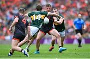 29 June 2025; Paddy Burns of Armagh in action against Kerry players Conor Geaney, left, and Tom O'Sullivan during the GAA Football All-Ireland Senior Championship quarter-final match between Armagh and Kerry at Croke Park in Dublin. Photo by Shauna Clinton/Sportsfile
