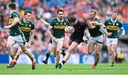 29 June 2025; Jarly Óg Burns of Armagh is tackled by Mark O'Shea of Kerry during the GAA Football All-Ireland Senior Championship quarter-final match between Armagh and Kerry at Croke Park in Dublin. Photo by Shauna Clinton/Sportsfile