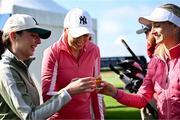 2 July 2025; Paralympic gold medalist Ellen Keane, left, former Republic of Ireland international Stephanie Zambra, centre, and content creator Nathalie Lennon, drink a shot of whiskey after playing their tee shots on the first hole during the Pro Am ahead of the 2025 KPMG Women’s Irish Open Golf Championship at Carton House Golf Club in Maynooth, Kildare. Photo by Seb Daly/Sportsfile
