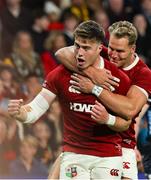 2 July 2025; Tommy Freeman of British & Irish Lions, left, celebrates with team mate Duhan van der Merwe after scoring their side's first try during the tour match between Queensland Reds and the British & Irish Lions at Suncorp Stadium in Brisbane, Australia. Photo by Steve Christo/Sportsfile