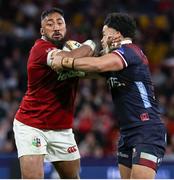 2 July 2025; Bundee Aki of British & Irish Lions is tackled by Hunter Paisami of Queensland Reds during the tour match between Queensland Reds and the British & Irish Lions at Suncorp Stadium in Brisbane, Australia. Photo by Steve Christo/Sportsfile