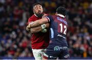 2 July 2025; Bundee Aki of British & Irish Lions is tackled by Hunter Paisami of Queensland Reds during the tour match between Queensland Reds and the British & Irish Lions at Suncorp Stadium in Brisbane, Australia. Photo by Steve Christo/Sportsfile