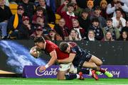 2 July 2025; Huw Jones of British & Irish Lions scores his side's seventh try despite the attempted tackle from Lachie Anderson of Queensland Reds during the tour match between Queensland Reds and the British & Irish Lions at Suncorp Stadium in Brisbane, Australia. Photo by Steve Christo/Sportsfile