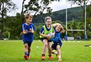 3 July 2025; Nina Gentles, centre, with Theo McLaughlin, left, and Harry Kenny during a Bank of Ireland Leinster Rugby Summer Camp at Stillorgan Rathfarnham RFC in Dublin. Photo by Sam Barnes/Sportsfile