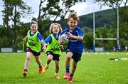 3 July 2025; Theo McLaughlin, right, with Harry Kenny and Nina Gentles during a Bank of Ireland Leinster Rugby Summer Camp at Stillorgan Rathfarnham RFC in Dublin. Photo by Sam Barnes/Sportsfile
