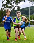 3 July 2025; Nina Gentles, centre, with Theo McLaughlin, left, and Harry Kenny during a Bank of Ireland Leinster Rugby Summer Camp at Stillorgan Rathfarnham RFC in Dublin. Photo by Sam Barnes/Sportsfile