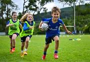 3 July 2025; Theo McLaughlin, right, with Harry Kenny and Nina Gentles during a Bank of Ireland Leinster Rugby Summer Camp at Stillorgan Rathfarnham RFC in Dublin. Photo by Sam Barnes/Sportsfile