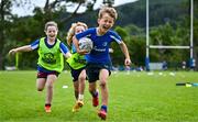 3 July 2025; Theo McLaughlin, right, with Harry Kenny and Nina Gentles during a Bank of Ireland Leinster Rugby Summer Camp at Stillorgan Rathfarnham RFC in Dublin. Photo by Sam Barnes/Sportsfile