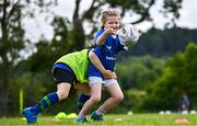3 July 2025; Isabelle McCarthy is tackled by Donnacha O'Sullivan during a Bank of Ireland Leinster Rugby Summer Camp at Stillorgan Rathfarnham RFC in Dublin. Photo by Sam Barnes/Sportsfile
