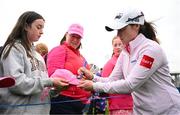 4 July 2025; Leona Maguire of Ireland signs her autograph for a supporter after completing her round on the 18th green during day two of the 2025 KPMG Women’s Irish Open Golf Championship at Carton House Golf Club in Maynooth, Kildare. Photo by Seb Daly/Sportsfile
