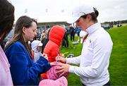 4 July 2025; Aine Donegan of Ireland signs her autograph for a supporter after completing her round on the 18th green during day two of the 2025 KPMG Women’s Irish Open Golf Championship at Carton House Golf Club in Maynooth, Kildare. Photo by Seb Daly/Sportsfile