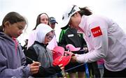 4 July 2025; Leona Maguire of Ireland signs her autograph for a supporter after completing her round on the 18th green during day two of the 2025 KPMG Women’s Irish Open Golf Championship at Carton House Golf Club in Maynooth, Kildare. Photo by Seb Daly/Sportsfile