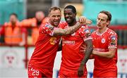 4 July 2025; Mipo Odubeko of Shelbourne, centre celebrates with teammates Paddy Barrett, left, and Harry Wood, right, after scoring their side's second goal during the SSE Airtricity Men's Premier Division match between Shelbourne and Cork City at Tolka Park in Dublin. Photo by Sam Barnes/Sportsfile