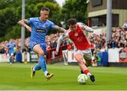 4 July 2025; Kian Leavy of St Patrick's Athletic in action against Rob Cornwall of Bohemians during the SSE Airtricity Men's Premier Division match between St Patrick's Athletic and Bohemians at Richmond Park in Dublin. Photo by Stephen McCarthy/Sportsfile