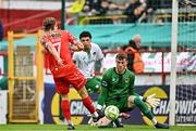 4 July 2025; Harry Wood of Shelbourne scores his side's first goal despite the efforts of Cork City goalkeeper Conor Brann during the SSE Airtricity Men's Premier Division match between Shelbourne and Cork City at Tolka Park in Dublin. Photo by Sam Barnes/Sportsfile