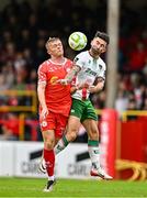 4 July 2025; Sean Maguire of Cork City in action against JJ Lunney of Shelbourne during the SSE Airtricity Men's Premier Division match between Shelbourne and Cork City at Tolka Park in Dublin. Photo by Sam Barnes/Sportsfile