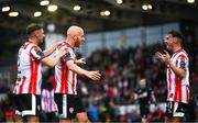 4 July 2025; Liam Boyce of Derry City celebrates with teammates Ronan Boyce, left, and Gavin Whyte after scoring their side's second goal during the SSE Airtricity Men's Premier Division match between Derry City and Waterford at The Ryan McBride Brandywell Stadium in Derry. Photo by Ramsey Cardy/Sportsfile