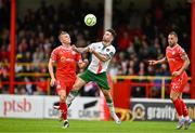 4 July 2025; Sean Maguire of Cork City in action against JJ Lunney of Shelbourne during the SSE Airtricity Men's Premier Division match between Shelbourne and Cork City at Tolka Park in Dublin. Photo by Sam Barnes/Sportsfile