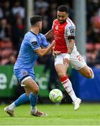 4 July 2025; Jake Mulraney of St Patrick's Athletic in action against Liam Smith of Bohemians during the SSE Airtricity Men's Premier Division match between St Patrick's Athletic and Bohemians at Richmond Park in Dublin. Photo by Stephen McCarthy/Sportsfile