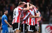 4 July 2025; Derry City players celebrate their side's third goal, scored by Sadou Diallo, during the SSE Airtricity Men's Premier Division match between Derry City and Waterford at The Ryan McBride Brandywell Stadium in Derry. Photo by Ramsey Cardy/Sportsfile