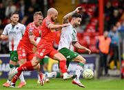 4 July 2025; Sean Maguire of Cork City in action against Mark Coyle and JJ Lunney of Shelbourne during the SSE Airtricity Men's Premier Division match between Shelbourne and Cork City at Tolka Park in Dublin. Photo by Sam Barnes/Sportsfile