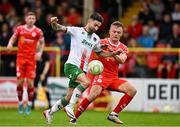 4 July 2025; Sean Maguire of Cork City in action against JJ Lunney of Shelbourne during the SSE Airtricity Men's Premier Division match between Shelbourne and Cork City at Tolka Park in Dublin. Photo by Sam Barnes/Sportsfile