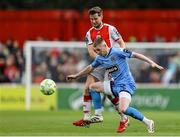 4 July 2025; Ross Tierney of Bohemians in action against Barry Baggley of St Patrick's Athletic during the SSE Airtricity Men's Premier Division match between St Patrick's Athletic and Bohemians at Richmond Park in Dublin. Photo by Thomas Flinkow/Sportsfile