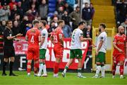 4 July 2025; Charlie Lyons of Cork City, 5, hands the captains armband over to teammate Greg Bolger after being shown a red card by referee Rob Harvey during the SSE Airtricity Men's Premier Division match between Shelbourne and Cork City at Tolka Park in Dublin. Photo by Sam Barnes/Sportsfile