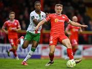 4 July 2025; JJ Lunney of Shelbourne in action against Malik Dijksteel of Cork City during the SSE Airtricity Men's Premier Division match between Shelbourne and Cork City at Tolka Park in Dublin. Photo by Sam Barnes/Sportsfile