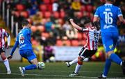 4 July 2025; Gavin Whyte of Derry City shoots to score his side's seventh goal despite the attention of Darragh Leahy of Waterford during the SSE Airtricity Men's Premier Division match between Derry City and Waterford at The Ryan McBride Brandywell Stadium in Derry. Photo by Ramsey Cardy/Sportsfile