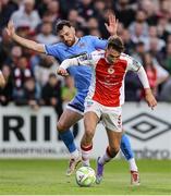 4 July 2025; Mason Melia of St Patrick's Athletic in action against Jordan Flores of Bohemians during the SSE Airtricity Men's Premier Division match between St Patrick's Athletic and Bohemians at Richmond Park in Dublin. Photo by Thomas Flinkow/Sportsfile