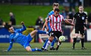 4 July 2025; Adam Frizzell of Derry City in action against Darragh Leahy, left, and Kyle White of Waterford during the SSE Airtricity Men's Premier Division match between Derry City and Waterford at The Ryan McBride Brandywell Stadium in Derry. Photo by Ramsey Cardy/Sportsfile