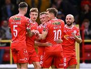 4 July 2025; JJ Lunney of Shelbourne, centre, celebrates  with teammates after scoring his side's third goal during the SSE Airtricity Men's Premier Division match between Shelbourne and Cork City at Tolka Park in Dublin. Photo by Sam Barnes/Sportsfile