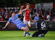 4 July 2025; James Clarke of Bohemians in action against St Patrick's Athletic goalkeeper Joseph Anang and Axel Sjoberg, centre, during the SSE Airtricity Men's Premier Division match between St Patrick's Athletic and Bohemians at Richmond Park in Dublin. Photo by Stephen McCarthy/Sportsfile