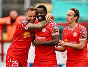 4 July 2025; Mipo Odubeko of Shelbourne, centre, celebrates with Paddy Barrett, left, and Harry Wood, right, after scoring their side's second goal during the SSE Airtricity Men's Premier Division match between Shelbourne and Cork City at Tolka Park in Dublin. Photo by Sam Barnes/Sportsfile