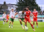4 July 2025; Milan Mbeng of Cork City in action against Ellis Chapman of Shelbourne during the SSE Airtricity Men's Premier Division match between Shelbourne and Cork City at Tolka Park in Dublin. Photo by Sam Barnes/Sportsfile