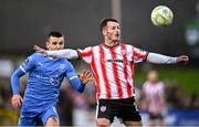 4 July 2025; Danny Mullen of Derry City in action against Darragh Leahy of Waterford during the SSE Airtricity Men's Premier Division match between Derry City and Waterford at The Ryan McBride Brandywell Stadium in Derry. Photo by Ramsey Cardy/Sportsfile
